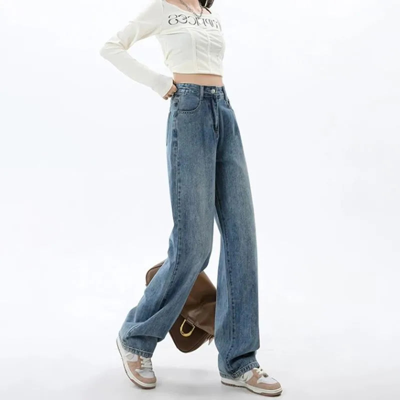 Woman wearing retro blue high waist wide leg jeans with a straight leg cut.