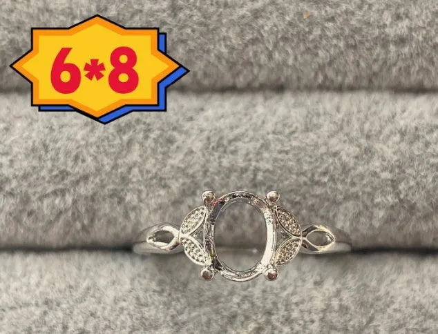 Oval denier ring ornament with open mouth design, 6x8mm stone and five-pointed star detail