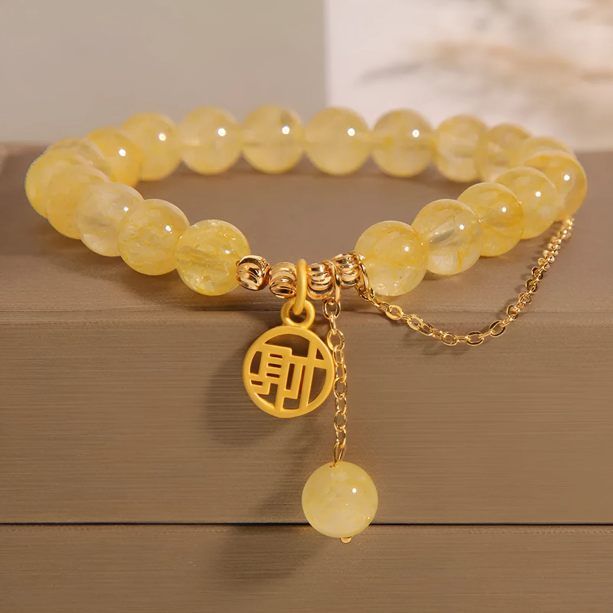 Natural citrine stone bracelet with electroplated metal and Chinese character tassel charm
