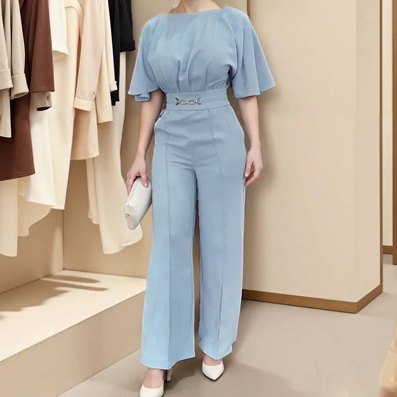 Blue men's slim fit two-piece polyester suit with long sleeve jacket and trousers on a hanger.