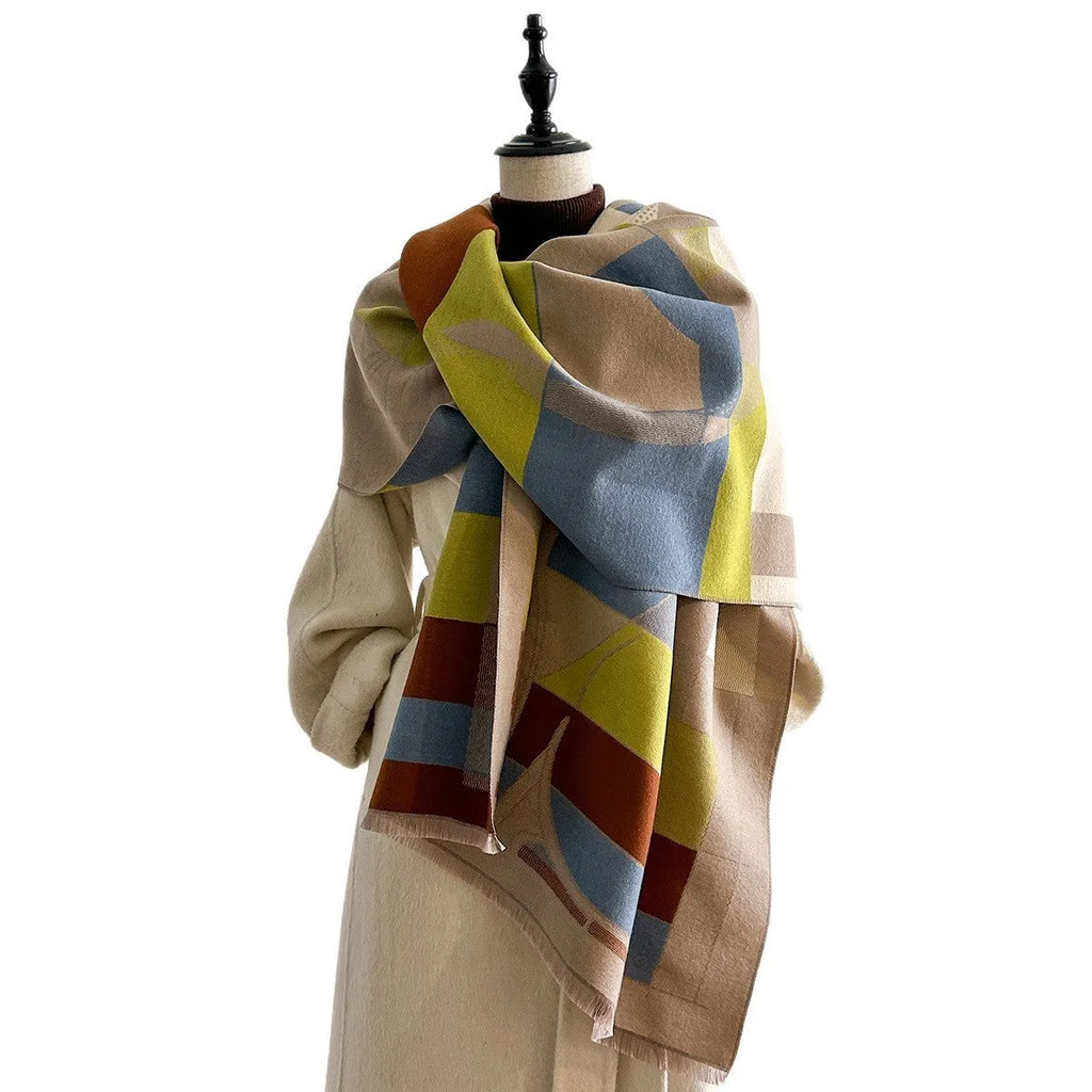 A long beige imitation cashmere scarf draped to show its 185cm length and texture.
