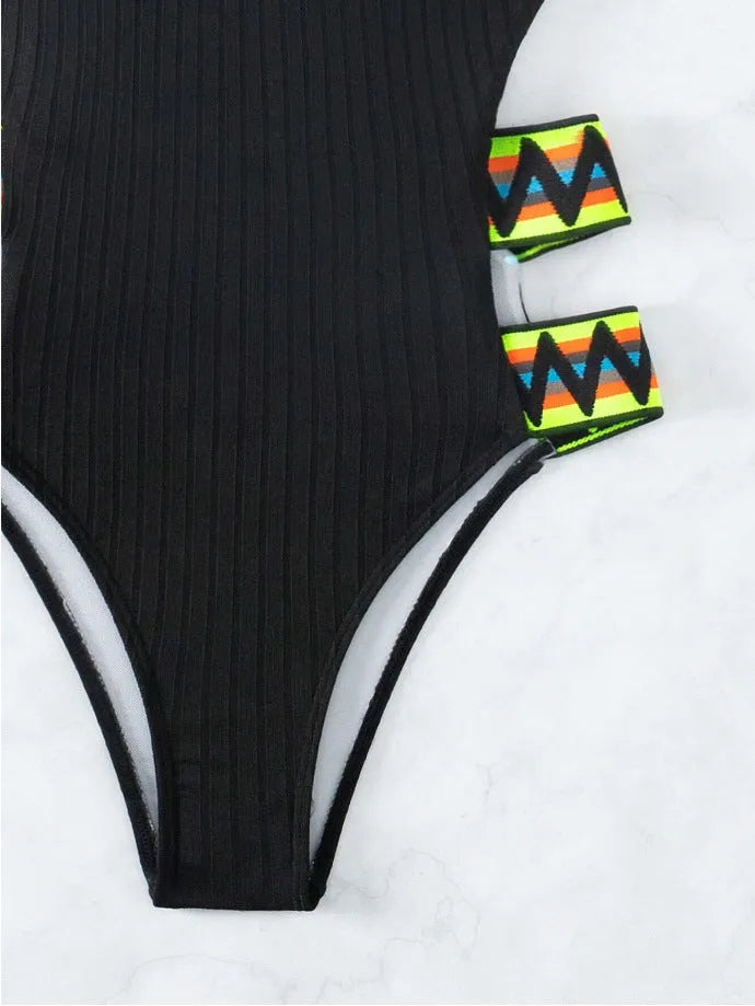 Women's solid colour one-piece swimsuit in black or orange polyester fabric
