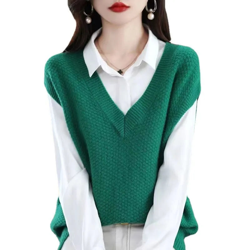 Women's creamy-white V-neck sleeveless knitted vest with a raised 3D stereoscopic pattern texture.