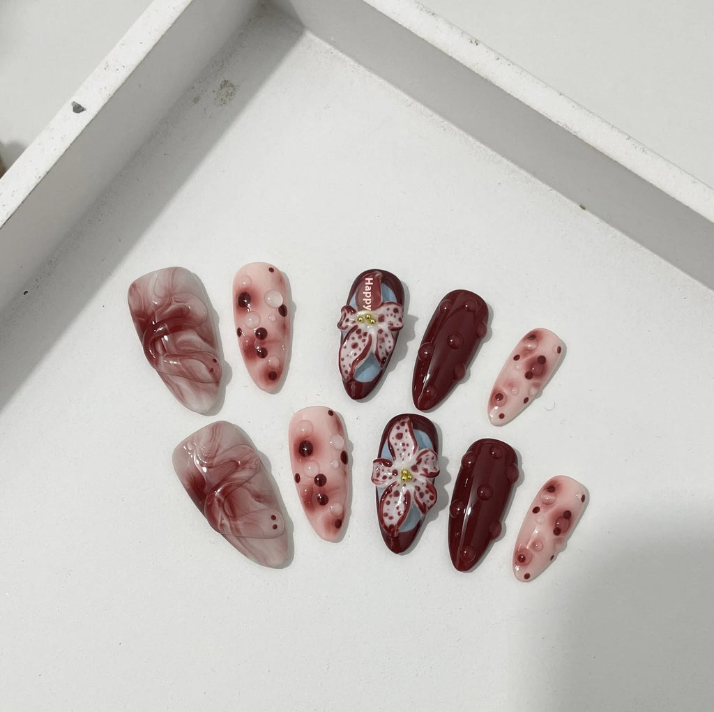 Almond-shaped false nails with hand-painted three-dimensional carved rose and starry sky patterns