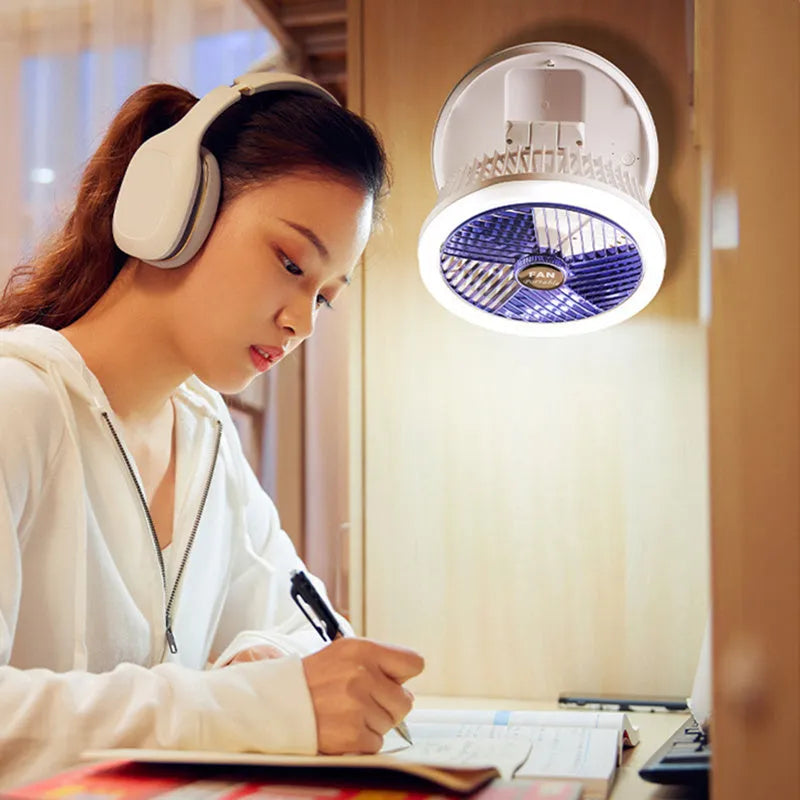 Blue foldable USB desk fan with LED light showing adjustable head and pen holder