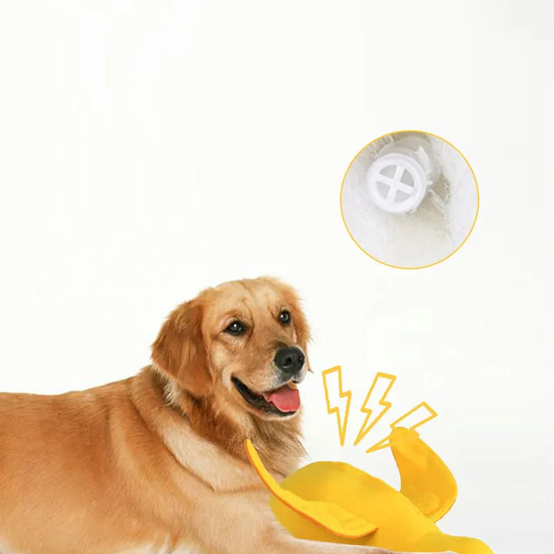 Yellow plush teddy dog toy with attached duck doll and food leak compartments for pet training