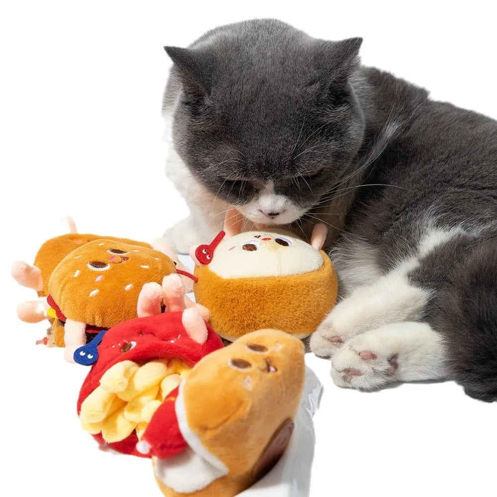 Assortment of kitten teething toys shaped like a hamburger, chicken leg, bread, fries, and hot dog.