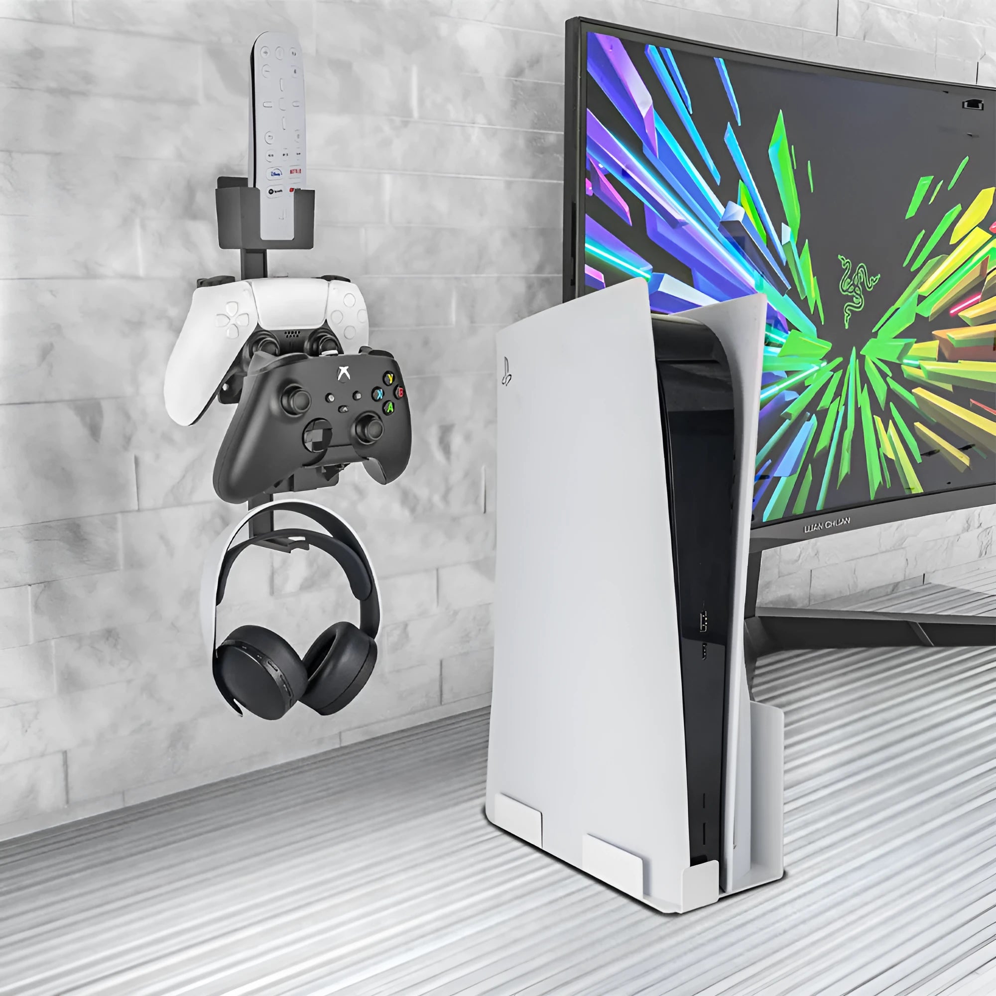 White wall-mounted hook holding a game controller with black console compatibility labels