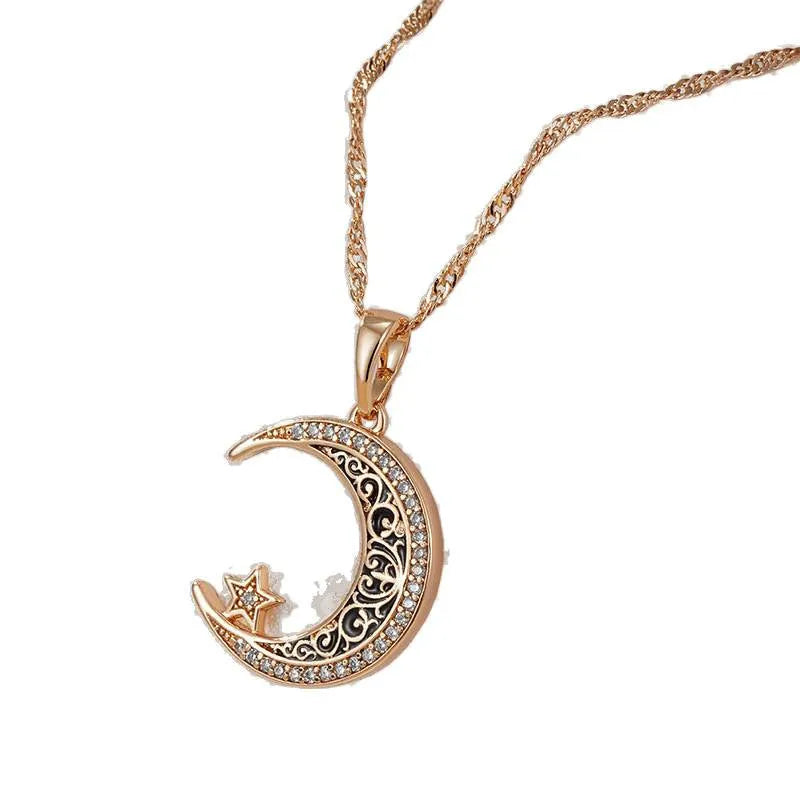Rose gold star and moon pendant necklace with zircon stone on an adjustable water wave chain.