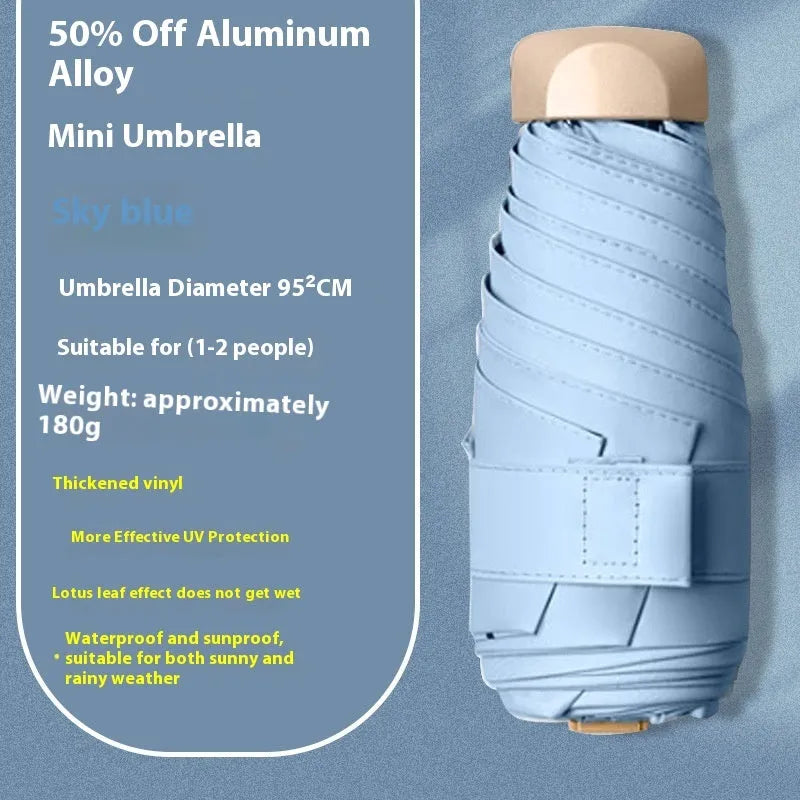 Closed five-fold manual umbrella with a gradient vinyl sunshade, showing the six-alloy-bone frame and one of eight colour options.