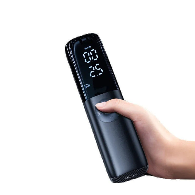 Black portable car air pump with tyre pressure gauge and inflation tube