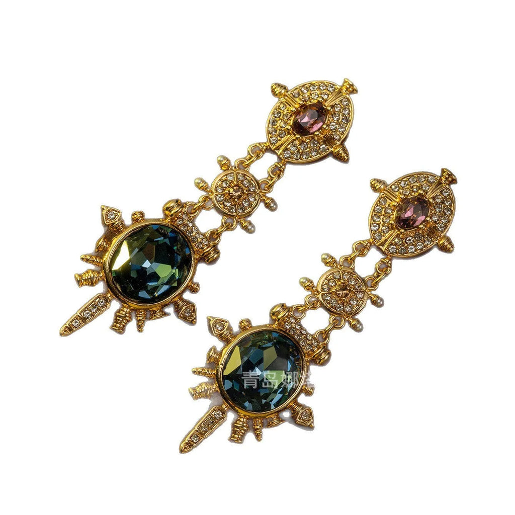 A pair of gold-coloured geometric round stud earrings with a retro style and diamond-treated alloy finish.