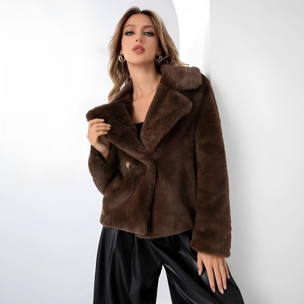 A woman wearing a rose red loose short faux fur coat with regular sleeves.