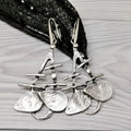 Silver alloy hollow leaf drop earrings for women with retro irregular step design and electroplated finish