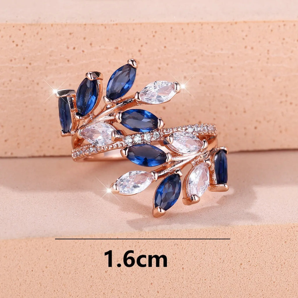 Adjustable horse eye zircon leaf ring in rose gold or platinum plating on a model's hand.