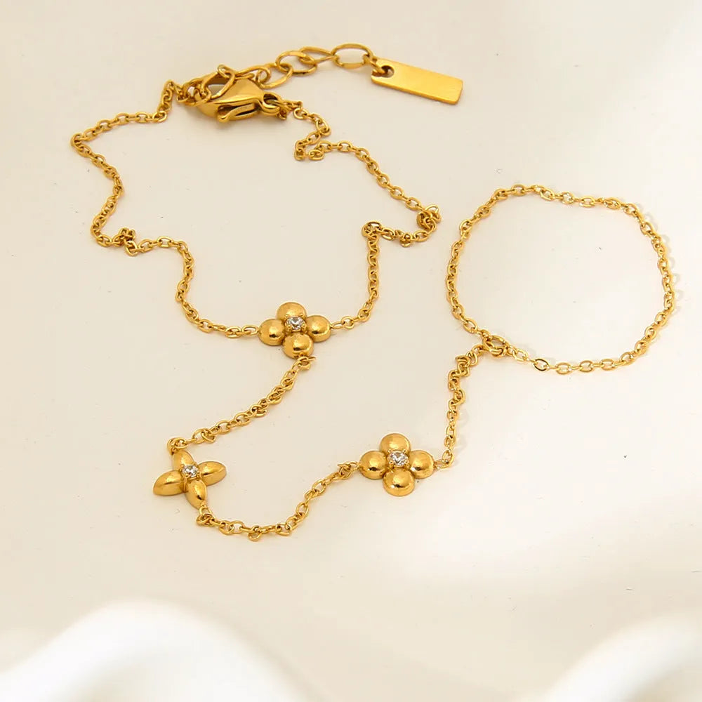 Gold-coloured women's bracelet with geometric flower and eight-pointed star design