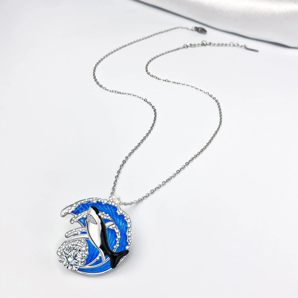 Copper shark pendant necklace with electroplated finish and adjustable cross chain measuring 41cm to 50cm