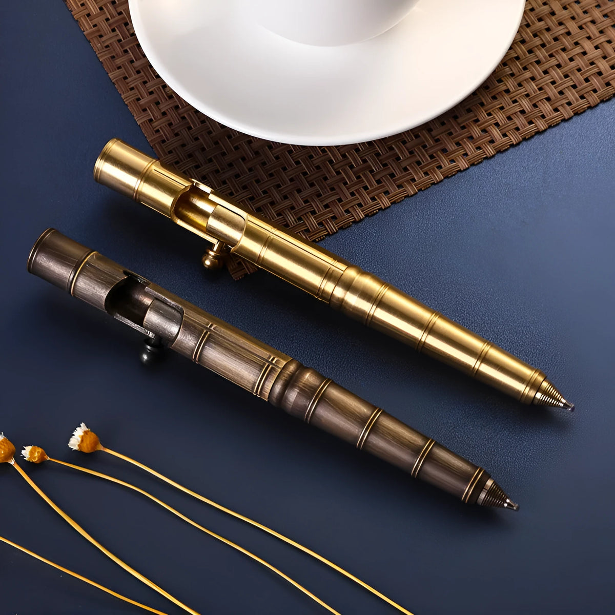 Brass tactical pen with press mechanism showing retro brass natural colour finish with hole pattern