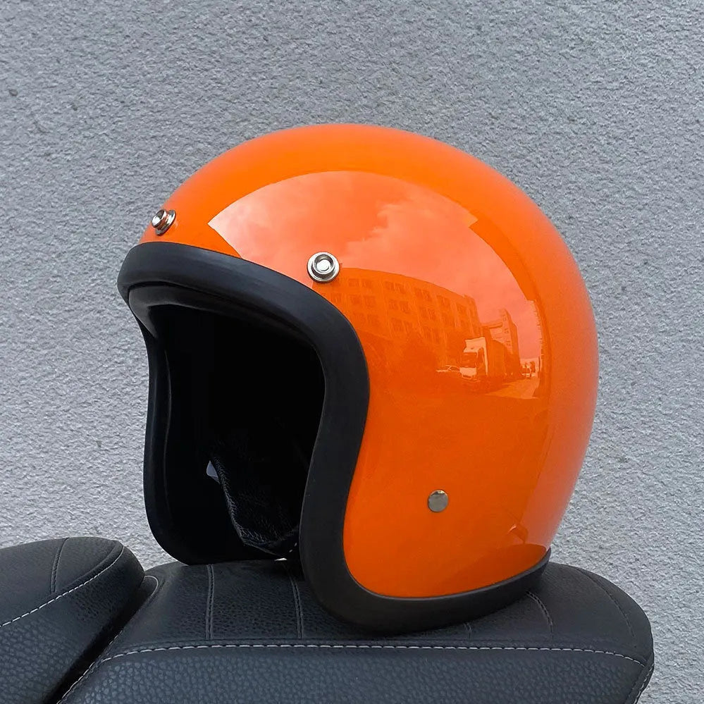 Retro-style half-shell motorcycle helmet in fibreglass, shown in a cement grey colour option.