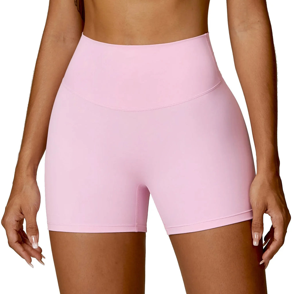 Women's high waist yoga shorts in basil green, showing contoured fit and hip-lifting design for sport.