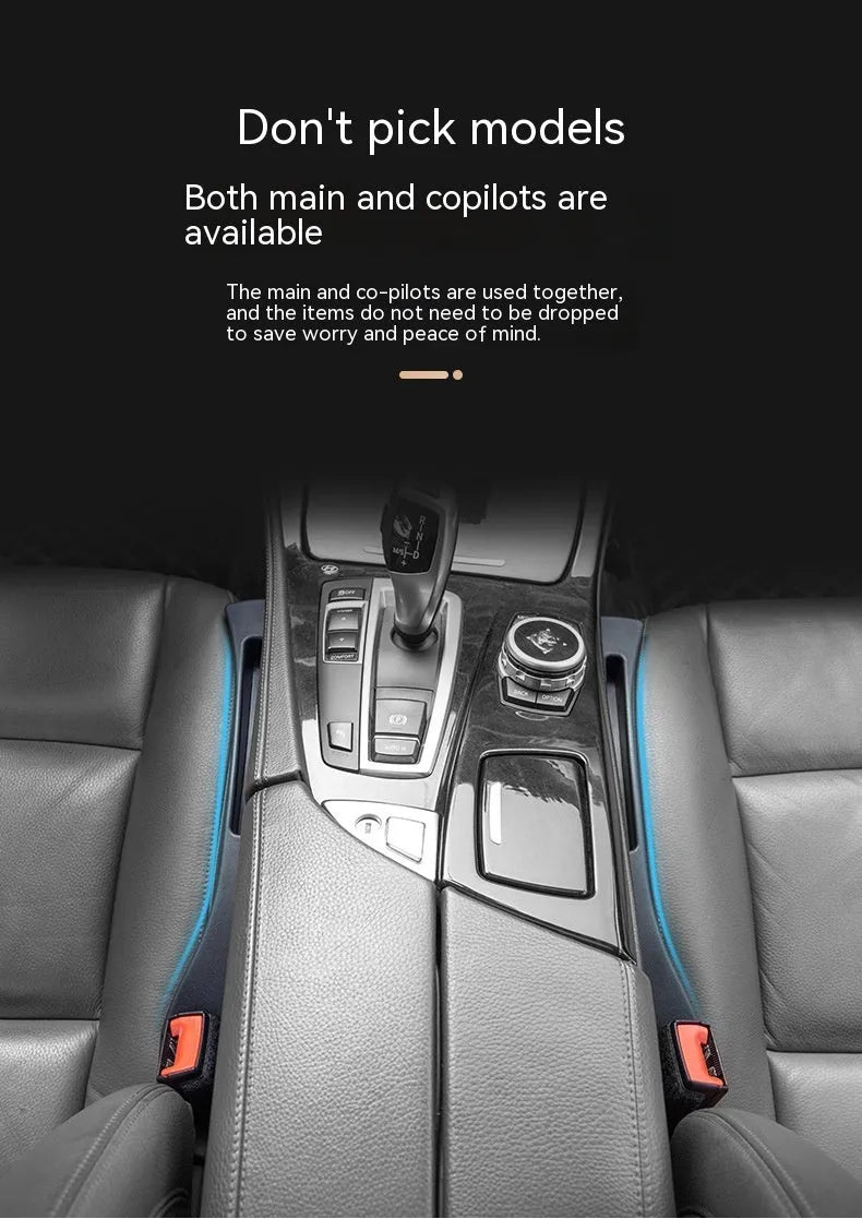 Black plastic car seat gap storage pocket with handle placed between vehicle seats.