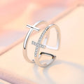 Adjustable copper ring with zircon stones in geometric design, showing open ring construction