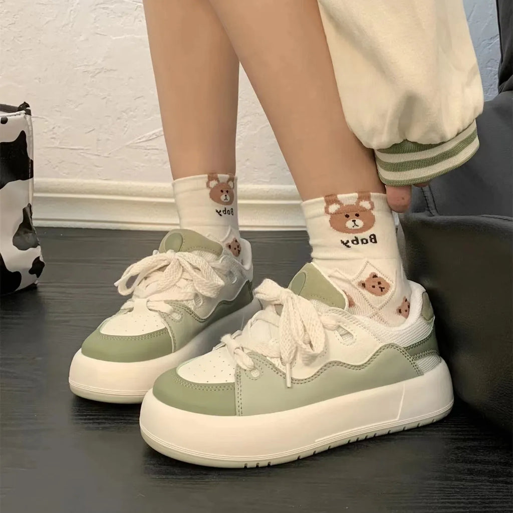 Green women's casual shoes with PU mesh uppers and a flat, non-slip sole.