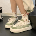 Green women's casual shoes with PU mesh uppers and a flat, non-slip sole.