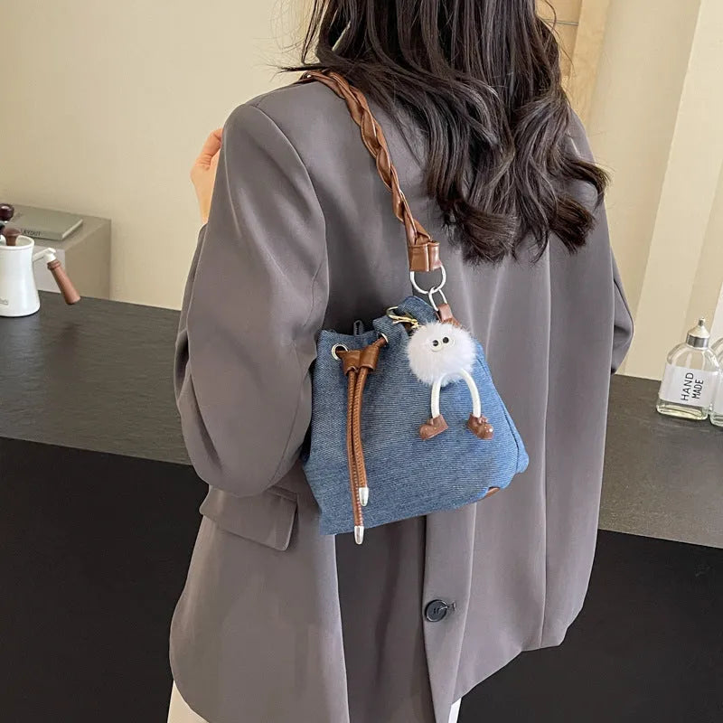 Blue synthetic leather one-shoulder cross body bucket bag with optional hanging ornaments