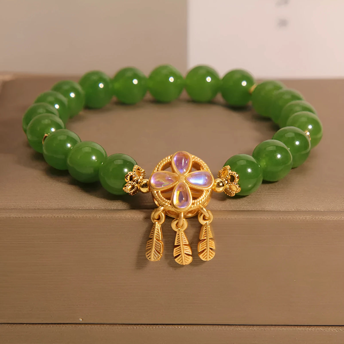 Green jasper crystal bracelet with four-leaf clover dream catcher pendant for women.