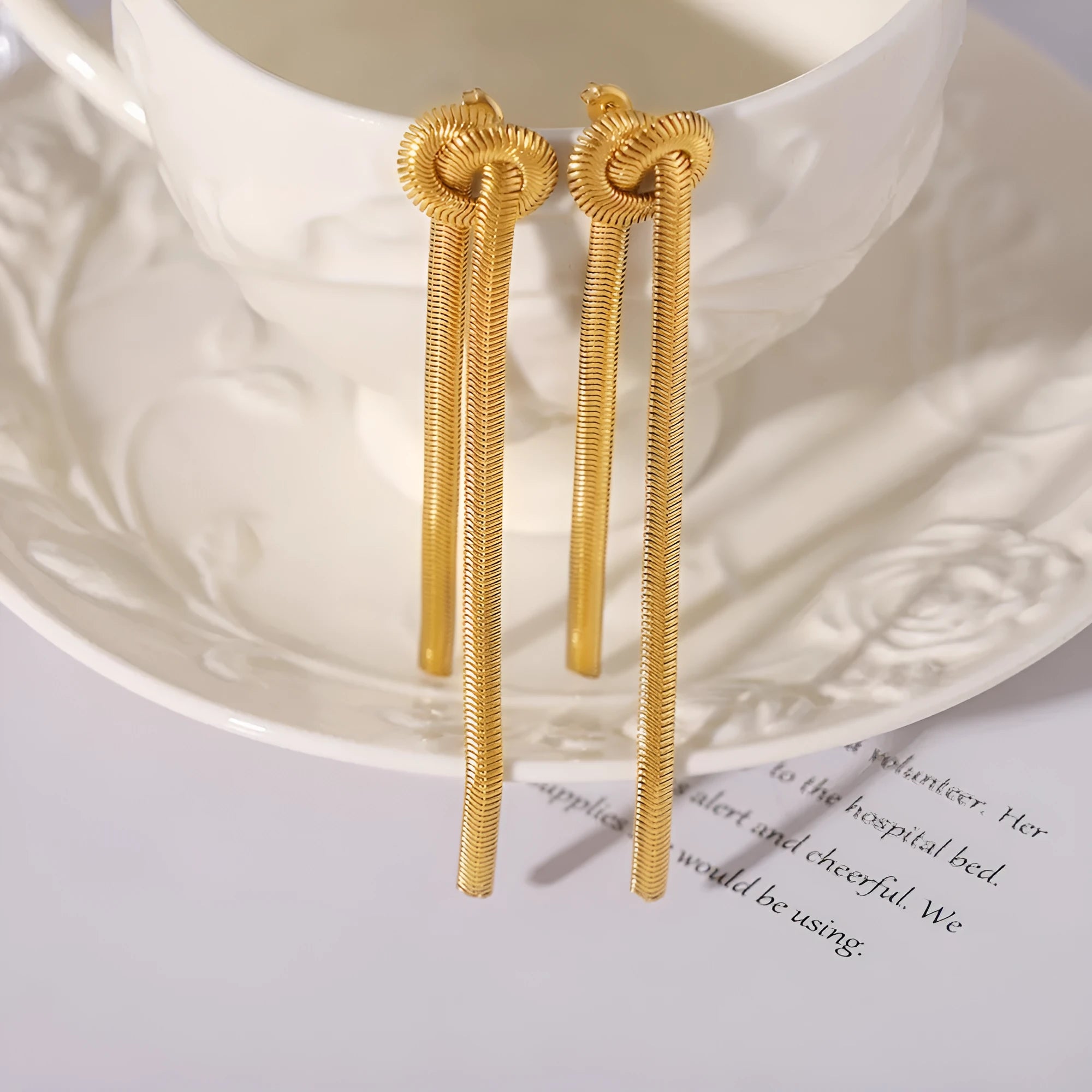Gold knotted tassel pendant on snake chain necklace with matching earrings set