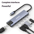 Aluminium Steam Deck docking station with HDMI, Ethernet, and USB ports on a desk