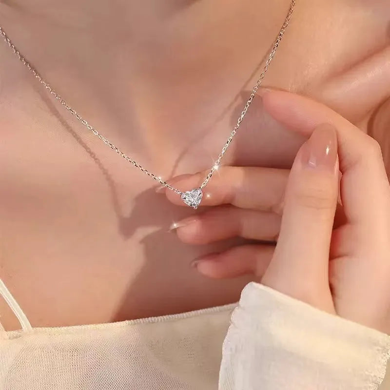 Silver-colour women's necklace with heart-shaped pendant in simple refined style