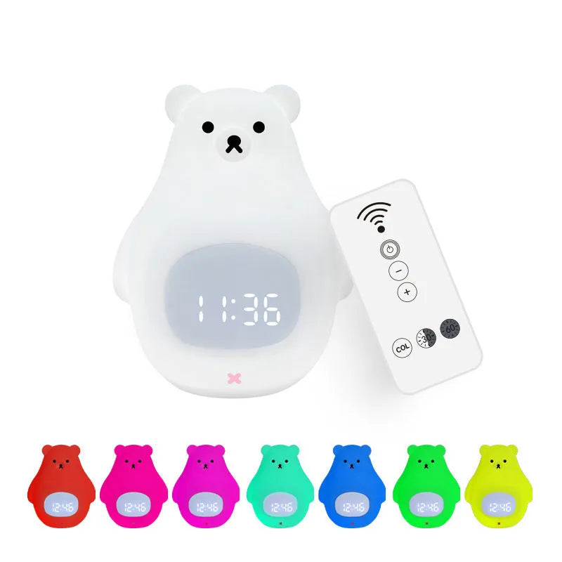 Big white bear shaped silicone night light with remote control on a table.