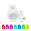 Big white bear shaped silicone night light with remote control on a table.