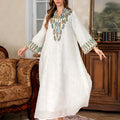 White full-length Arabic robe for women with long sleeves, made from polyester fabric.