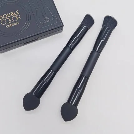 Elegant black double-headed makeup brush with a miter sponge and concealer brush on a wooden handle