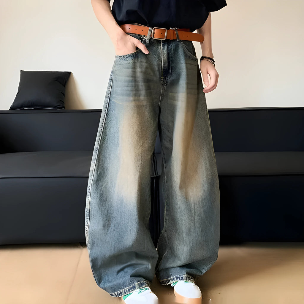Men's retro blue distressed denim jeans with wide-leg trouser design and micro-elastic fabric