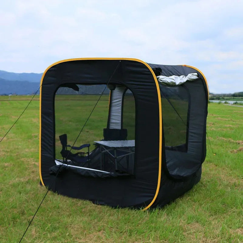 Black pop-up car tail tent with quick-throw setup shown connected to vehicle