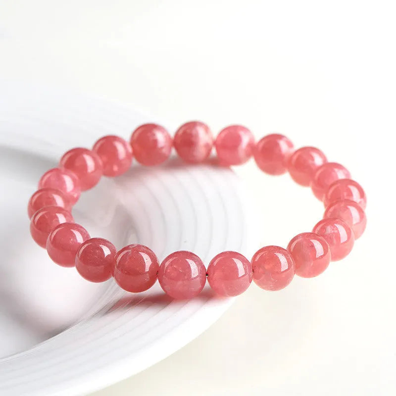 Women's crystal bracelet with geometric red stone beads and longevity lock charm