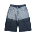 Blue tie-dye gradient cropped jeans with a loose fit and washed-out, worn-looking finish.