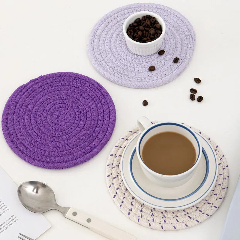 Three round 18cm cotton cord coasters in a set, shown in a blue colour option.