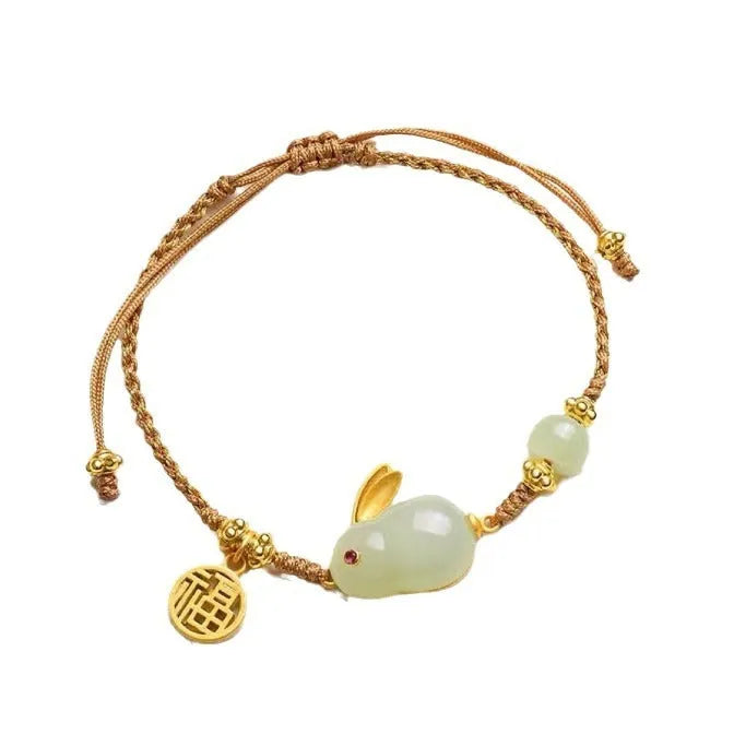 Yellow string bracelet with a geometric Hetian jade charm shaped like a rabbit for women.
