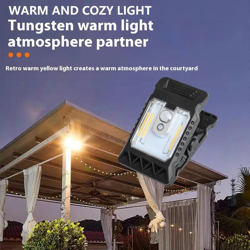 Compact white ABS clip lamp with motion sensor, shown clipped to a shelf edge