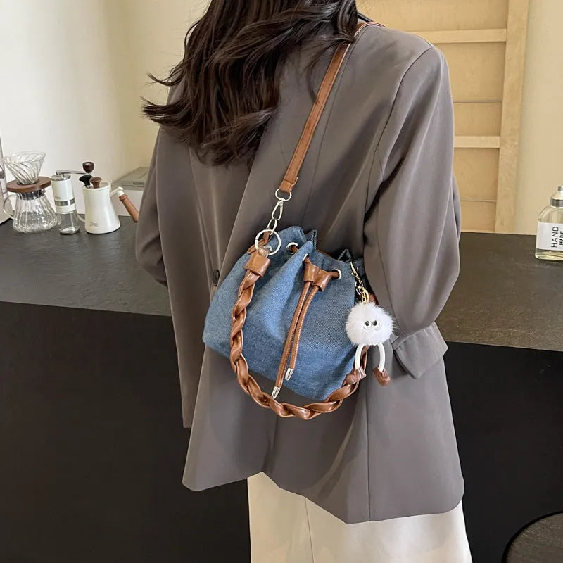 Blue synthetic leather one-shoulder cross body bucket bag with optional hanging ornaments