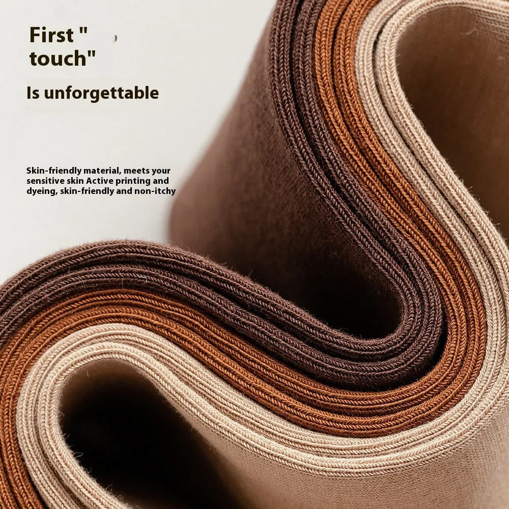 A pair of solid colour men's mid-calf socks in combed cotton, shown in a light grey shade.