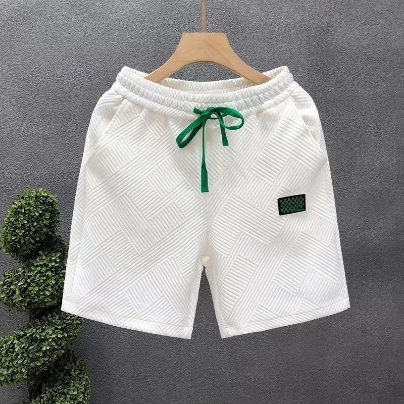 Micro-elastic polyester sports shorts in white, black and green colours for beach and casual wear