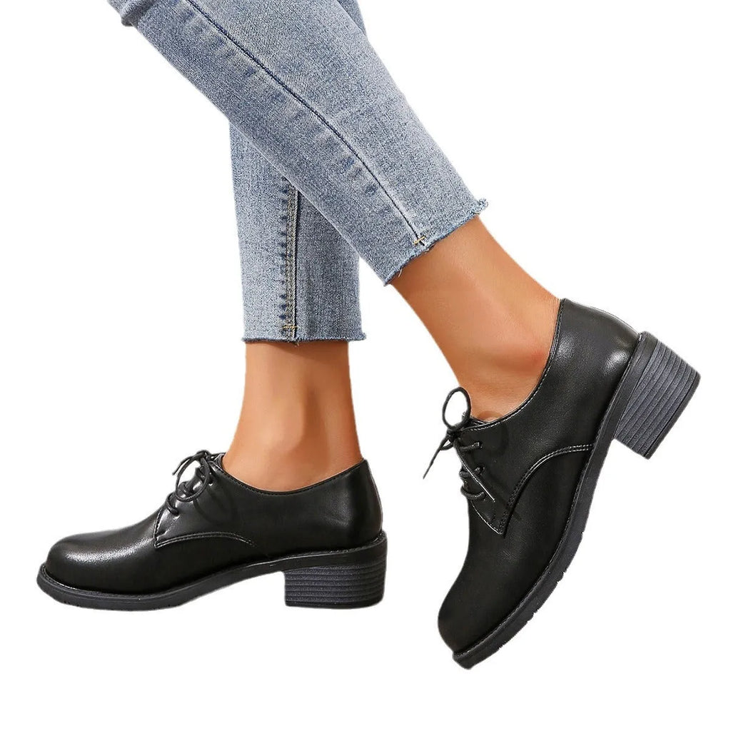 Black women's professional work shoes with chunky heel and pointed toe design