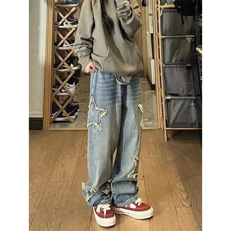 Blue high-waist women's jeans with a wide, straight leg, laid flat.