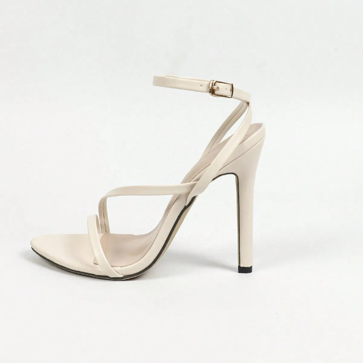 Gold women's high heel sandals with a cross ankle strap and open round toe.